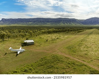 Small turboprop aircraft at outback grass runway - Powered by Shutterstock