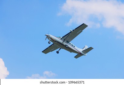 Small Turboprop Plane Against A Blue Sky