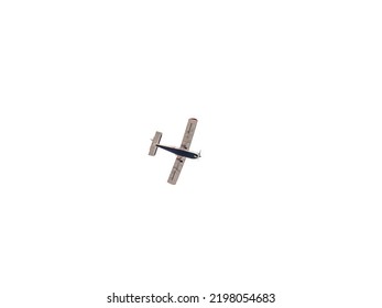 Small Ultralight Airplane With Overhead Wing And Single Propeller Flying In Sunset Sky. Such Aircraft Are Used For Recreational, Sport And Flight Training.