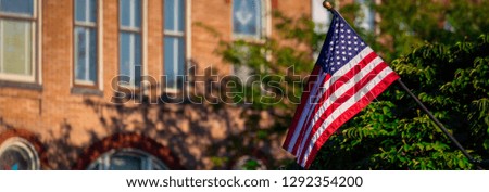 A small US flag attached to a light pole in Gettysburg, PA.