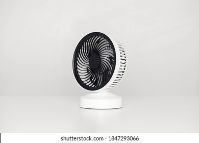 Small USB Desktop Fan Isolated On A White Desk