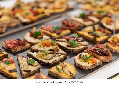 Small vegan sandwiches at snack buffet - Shutterstock ID 1577527825