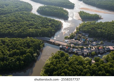 A small village nestled amidst lush mangrove forests and a winding river.Satun, Thailand. Aerial view landscape. - Powered by Shutterstock