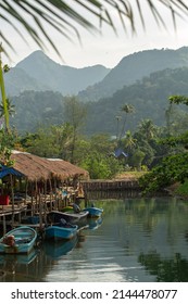 A small village on a river in the tropical jungle. 