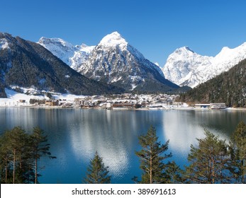 Small village Pertisau at Lake Achensee with snow-covered mountains in the background, Tyrol, Austria