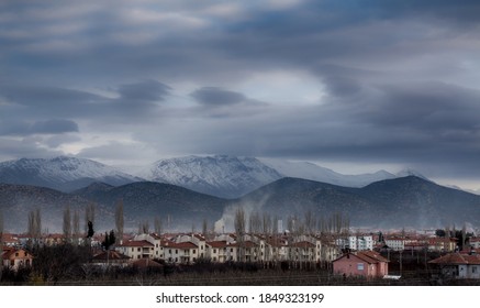 Small Village Under Dramatic Clouds