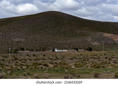 Small Village With White Church And Mountain In The Background. Andes Mountain Range