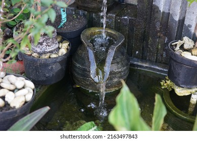 Small Waterfall In Small Fish Pond