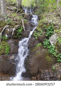 Small waterfall flowing down rocks 