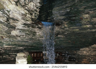 A small waterfall in a grotto in a canyon, Watkins Glen State Park, Pennsylvania - Powered by Shutterstock