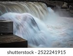 A small waterfall in Kutton, Neelum Valley of Azad Kashmir, Pakistan. A small dam is constructed on a streamed water to generate electricity for the villages around