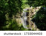 Small waterfall at the Lac des Minimes in The Bois de Vincennes located on the eastern edge of Paris, France.