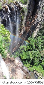 a small waterfall making a rainbow