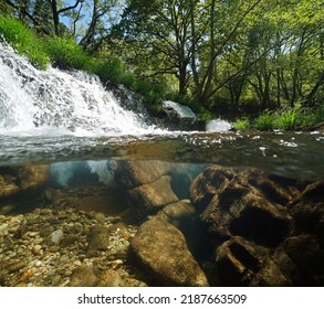 Small Waterfall On A River Over And Under Water Surface Split Level View, Spain, Galicia, Rio Verdugo