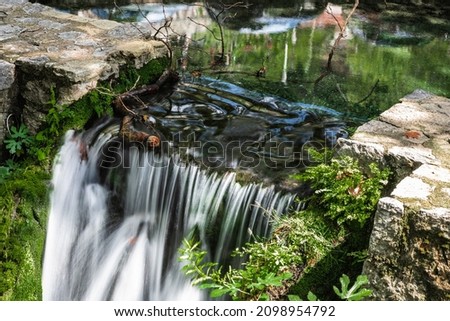 A small waterfall on a stone dam
