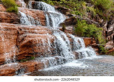 Small waterfall over the rocks and among the vegetation of the Biribiri park in Diamantina, Minas Gerais