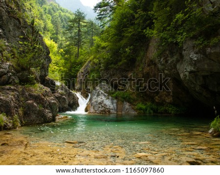 Small waterfall with perfectly clear water, Olympus National Park, Enipeas Canyon, Greece