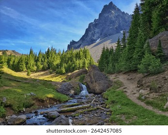 Small Waterfall and Stream Flowing at the Base of the Spire-like Mount Thielsen Peak Along the Pacific Crest Trail