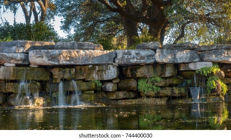 Small Waterfall Surrounded by Large Trees