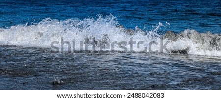 Similar – waves and splashes of sea surf and stones on the seashore in Egypt Dahab South Sinai