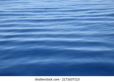 Small waves in sea water reflecting light in the Mediterranean Sea - Shutterstock ID 2171637113