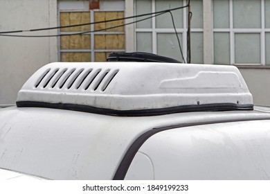 Small White Aerodynamic Cooling Box At Car Roof