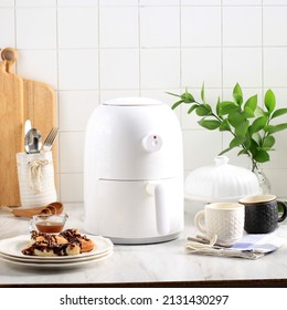 Small White Airfryer Kitchen Gadget, Most Popular Cooking Tools In 2020. Cooking With No Oil For Healthy And Diet. Concept Modern Kitchen