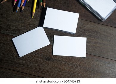 Small White Business Card Sort Heap On The Wood Floor