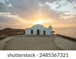 Small white church in the typical architectural style of Greece. She stands on a tree surrounded by the Mediterranean and in the sunrise.
Chapel of Agios Nikolaos, Ionian Islands, Greece