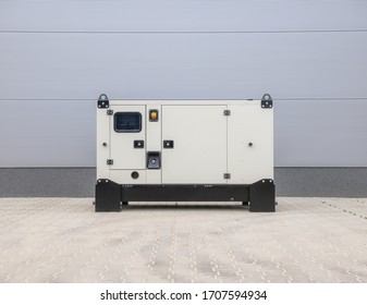 Small White Electric Generator Outdside