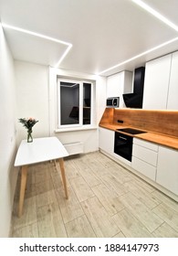 Small White Kitchen Interior. Modern Minimalist Apartment In White With Black And Wood Elements. Hygge, Lagom.