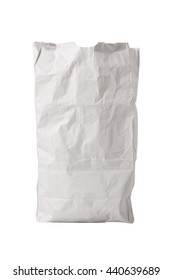 A Small White Paper Bag, Wrinkled With Some Grease Spots, Possibly For Fast Food, Sitting Upright, Isolated