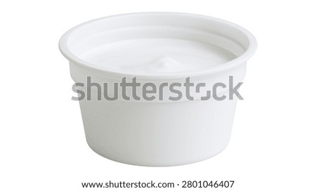 Small white plastic cup filled with creamy yogurt or sour cream