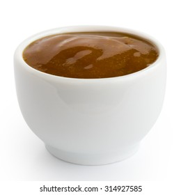 Small White Pot Of Curry Sauce Dip, In Perspective Isolated On White.