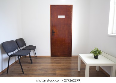 Small White Waiting Room Without People. A Doctor, Dentist Or Other Medical Practitioner Provides This Room For The Use Of People Who Are Waiting To Be Seen. 