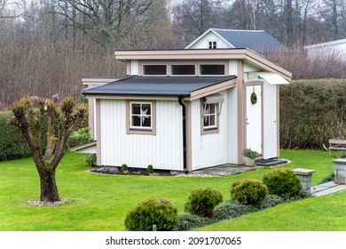 Small White Wooden Guest House In The Back Yard