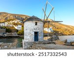 Small windmill in the port of Aegiali on Amorgos island. Cyclades, Greece