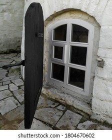 Small window with a black door