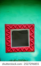 a small window in mud wall in leh town near thiskey monastery, india