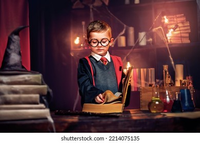 Small wizard reads magic book Cosplay. Halloween holiday. Halloween costume party. - Shutterstock ID 2214075135