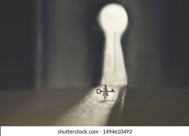 small woman carries the key to open the lock - Shutterstock ID 1494610493