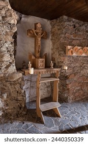 A small wooden altar in a niche of the castle wall.