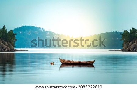 Small wooden boat in the middle of a lake, Lonely wooden boat in the water, isolated wooden boat, Top view of a white small wooden boat floating in the middle of a lake