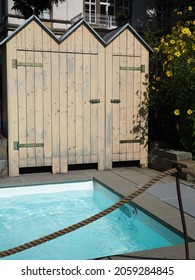 Small Wooden Changing Rooms Near The Swimming Pool