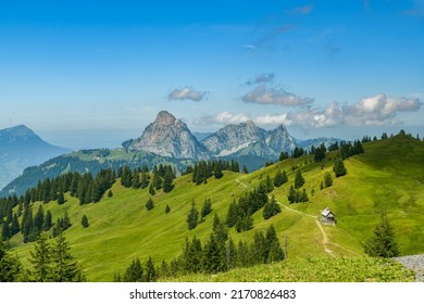 Small wooden chapel high in the mountains above Oberiberg in Switzerland with views on Grosser Mythen peak in background