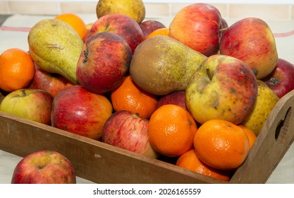 A Small Wooden Crate With Fruits
