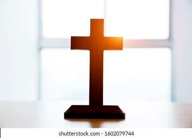 Small Wooden Cross On Table.