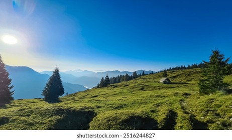 Small wooden high altitude hut on alpine meadow near Latschur, Gailtal Alps, Carinthia, Austria. Hiking trail with panoramic view of mountain ridges of majestic Carnic Alps. Peaceful serene atmosphere - Powered by Shutterstock