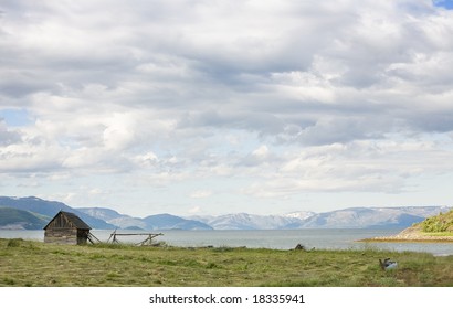 Small Wooden House On Sea Coast. North Sea, Norway