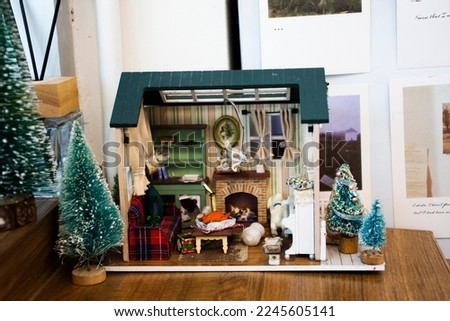 Small wooden house toy and interior decoration furniture living home europe style and xmas with tree christmas for thai children people playing at Bangkok, Thailand